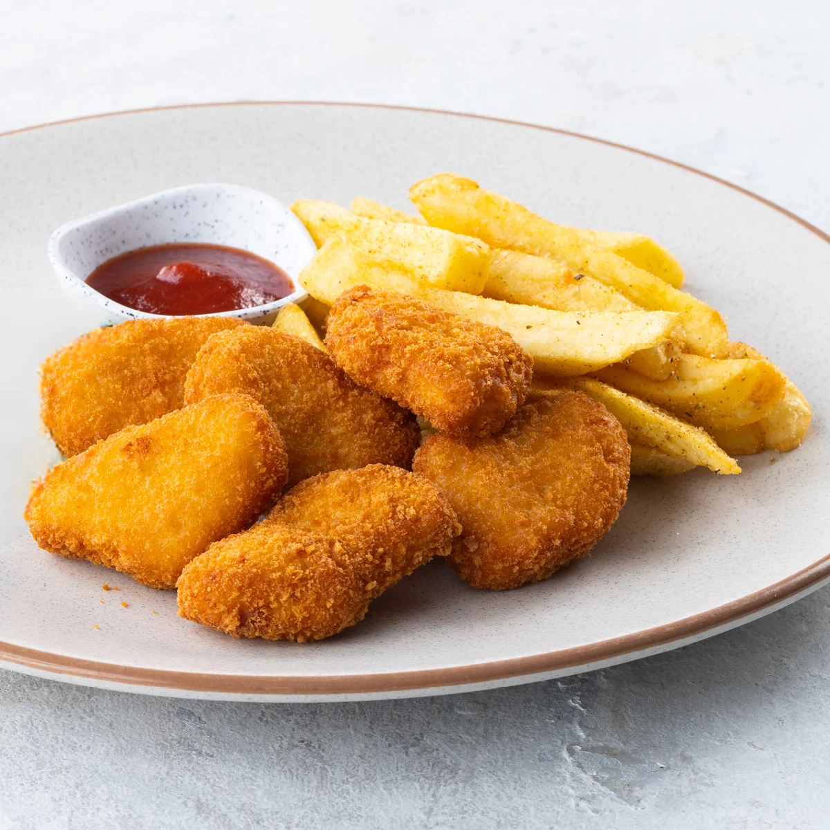 Chicken nuggets and chips with ketchup, from the children's menu